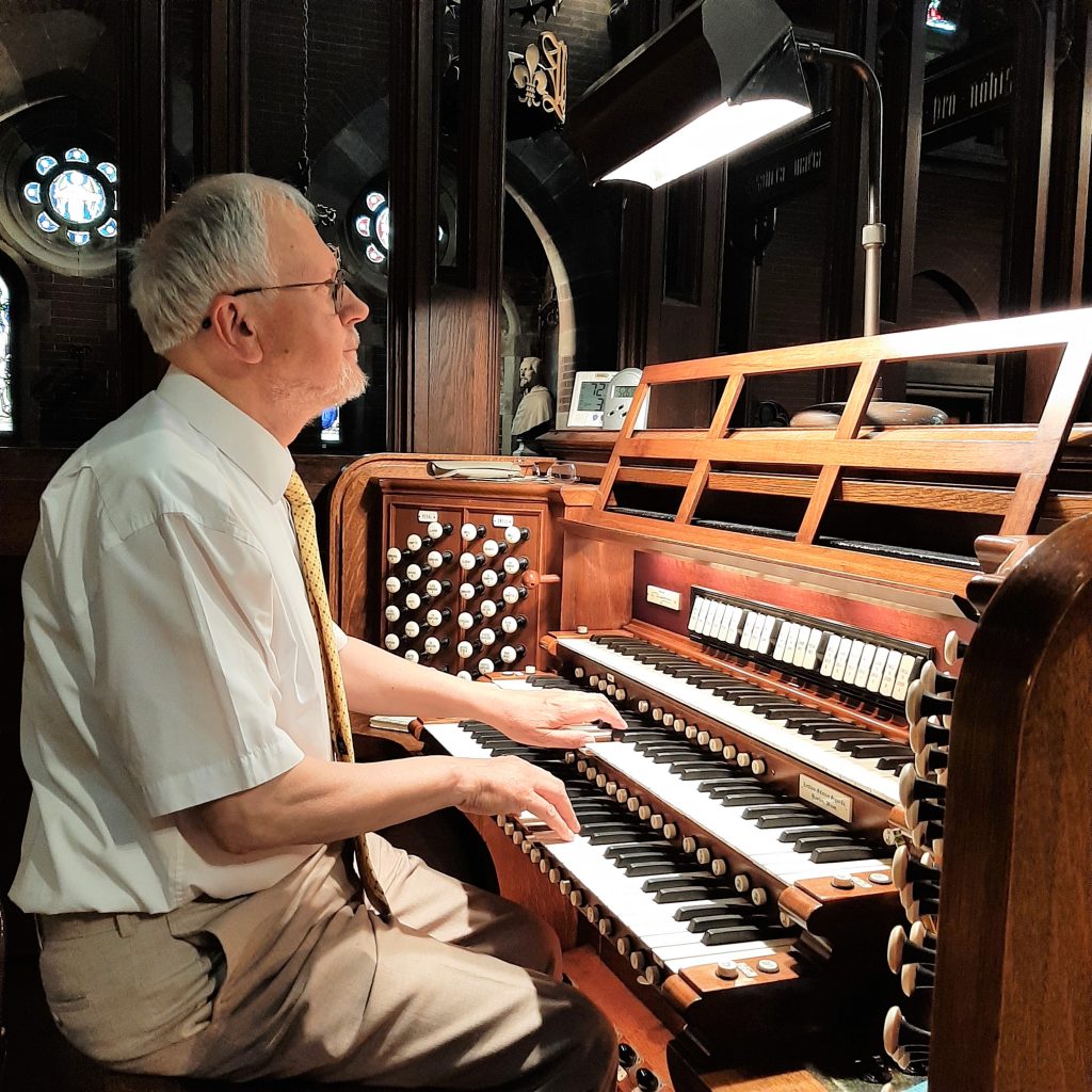 Organist playing an organ